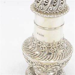 Late Victorian silver sugar caster, of typical waisted form, with embossed scrolling and foliate decoration and urn finial to removable pierced cover, upon circular foot, hallmarked Fenton Brothers, Sheffield 1895, H19cm