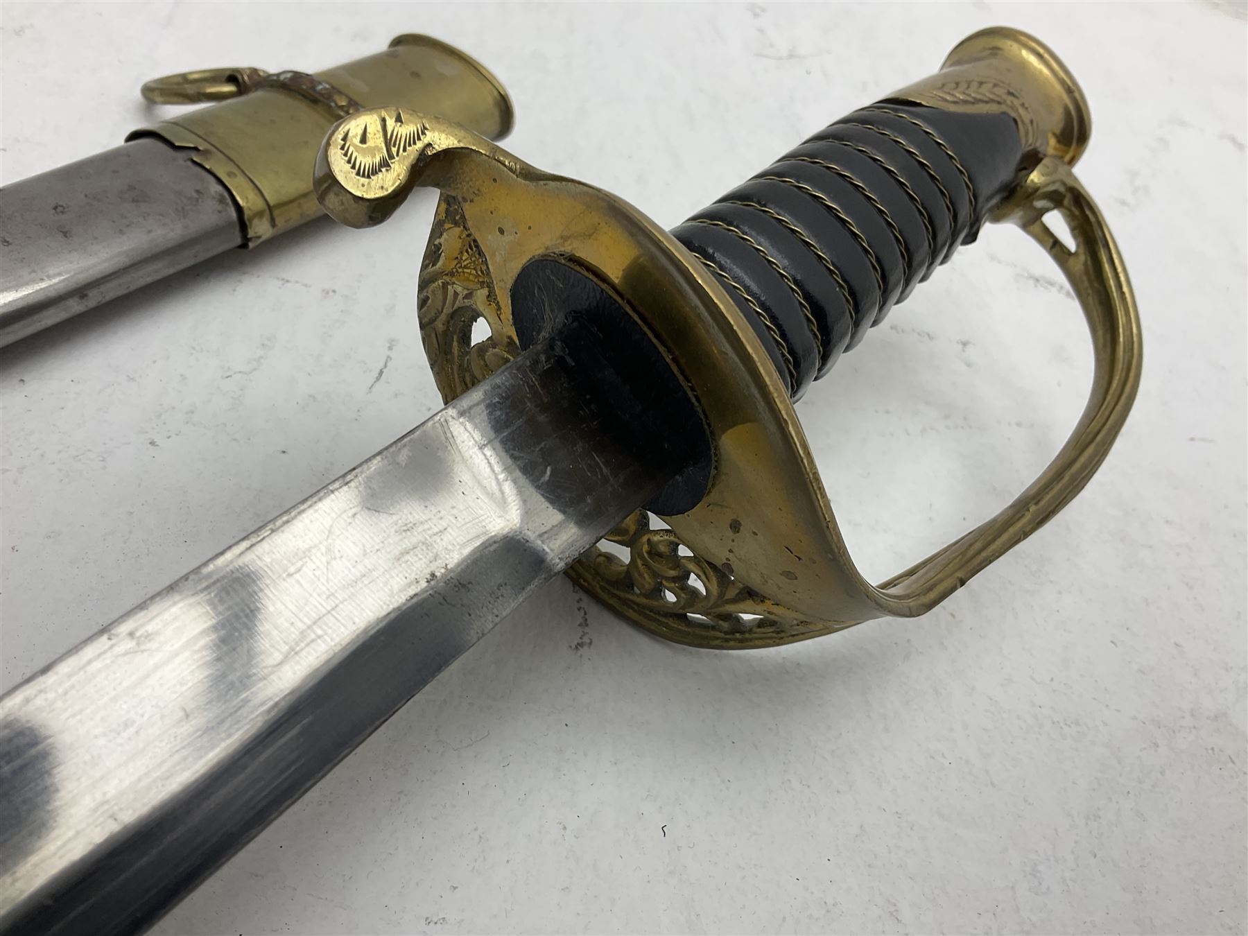 Reproduction American Civil War Cavalry trooper's sword, the 88cm slightly curving fullered steel blade marked to the ricasso 'Ames & Co Chicopee Mass.' and 'US ADK 1862'; brass hilt and leather covered grip; in steel scabbard L110cm overall;  and another reproduction sword (2)