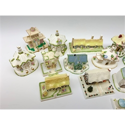 A collection of Coalport pastille burners modelled in the form of cottages and various buildings, together with models of buildings. (18). 