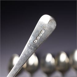 Set of six George III silver dessert spoons with bright cut stemsLondon 1818 Maker Thomas Wallis II and Jonathan Hayne, three other silver dessert spoons and a silver berry spoon with gilded bowl (10)