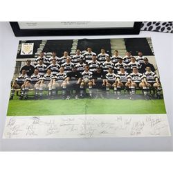 Hull F.C. memorabilia; Clive Sullivan 1986 memorial game programme, Open Evening 1994 programme with multiple player signatures, 'Old Faithful' 45rpm record, Wembley rosettes, 2000 team poster with facsimile signatures, framed print 'Farewell to the Boulevard 1895-2002', fully signed team photograph, various booklets, CD, DVD etc; and a folder containing the Merlin Rugby League card collection