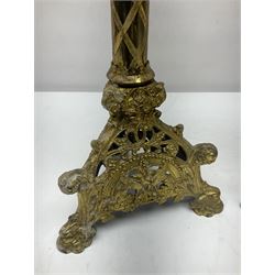Pair of gilt metal pricket candlesticks, with applied decoration on knopt stems and triform bases, H47cm