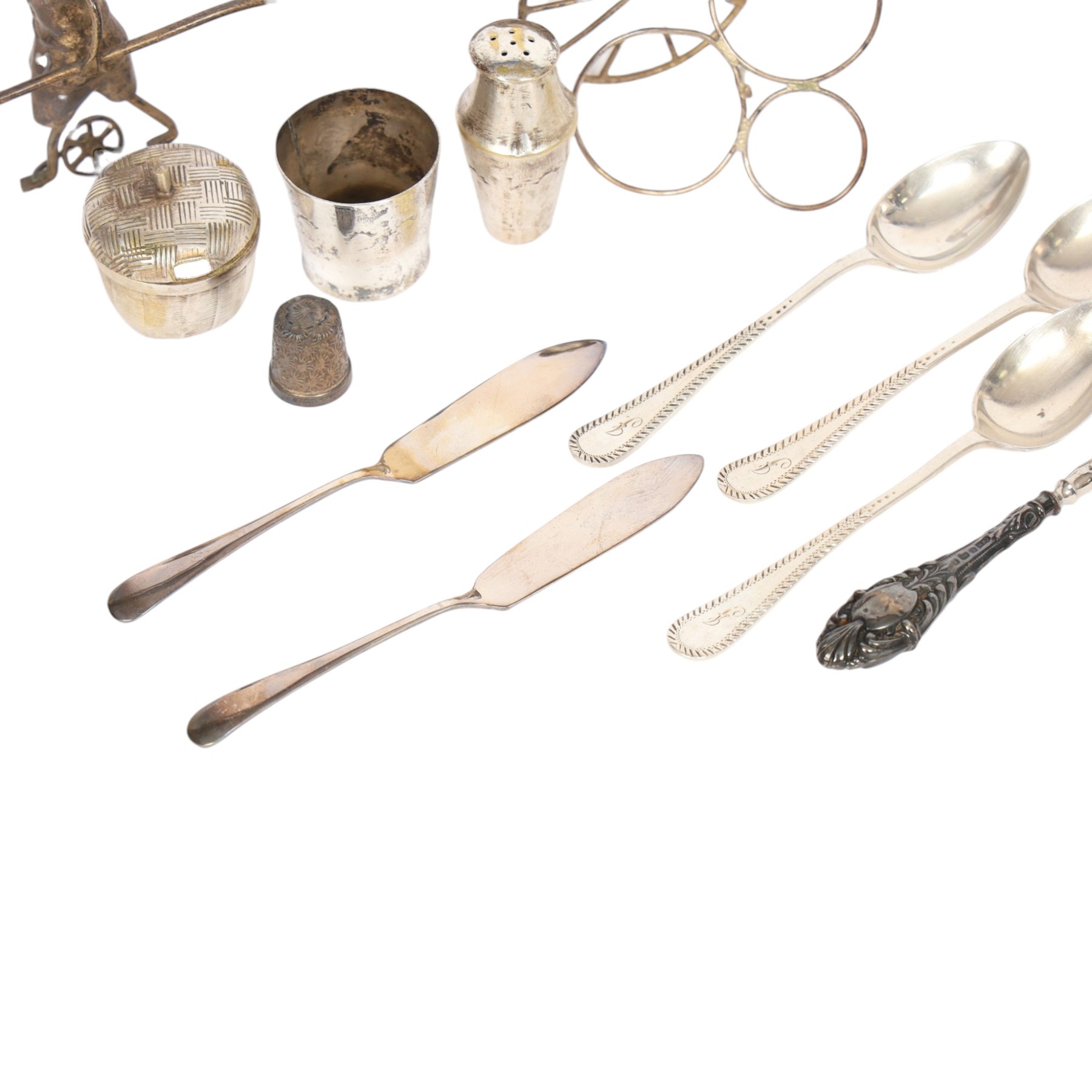 Silver cutlery comprising three teaspoons and two butter knives, a silver handled hook and a silver plated Chinese rickshaw cruet