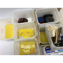 Meccano - large quantity of metal and plastic sections, various colours and ages, well presented and categorised in over forty plastic tubs including various sized flat and flanged plates, girders, wheels and tyres, pulleys, angle strips, boilers, sleeve pieces, chimneys, crank handles etc