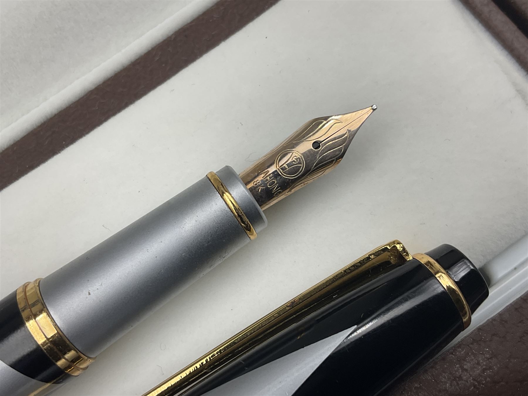 Circa 1930s Mentmore Auto Flow button fill fountain pen, the black barrel and cap with single narrow band and gold nib stamped Osmi Ridium 14ct, together with two gold nib fountain pens, each marked Huahong, the first stamped 14K 580, and second stamped 8K, both housed in Mentmore boxes (3)