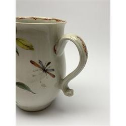 18th century porcelain mug, of baluster form hand painted with strawberry, yellow flowers, and dragonfly, the loop handle and inner rim detailed with red feathering, H11cm 