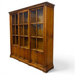 Wesley Barrel - large cherry wood bookcase, with projecting cornice and fielded panelled s...