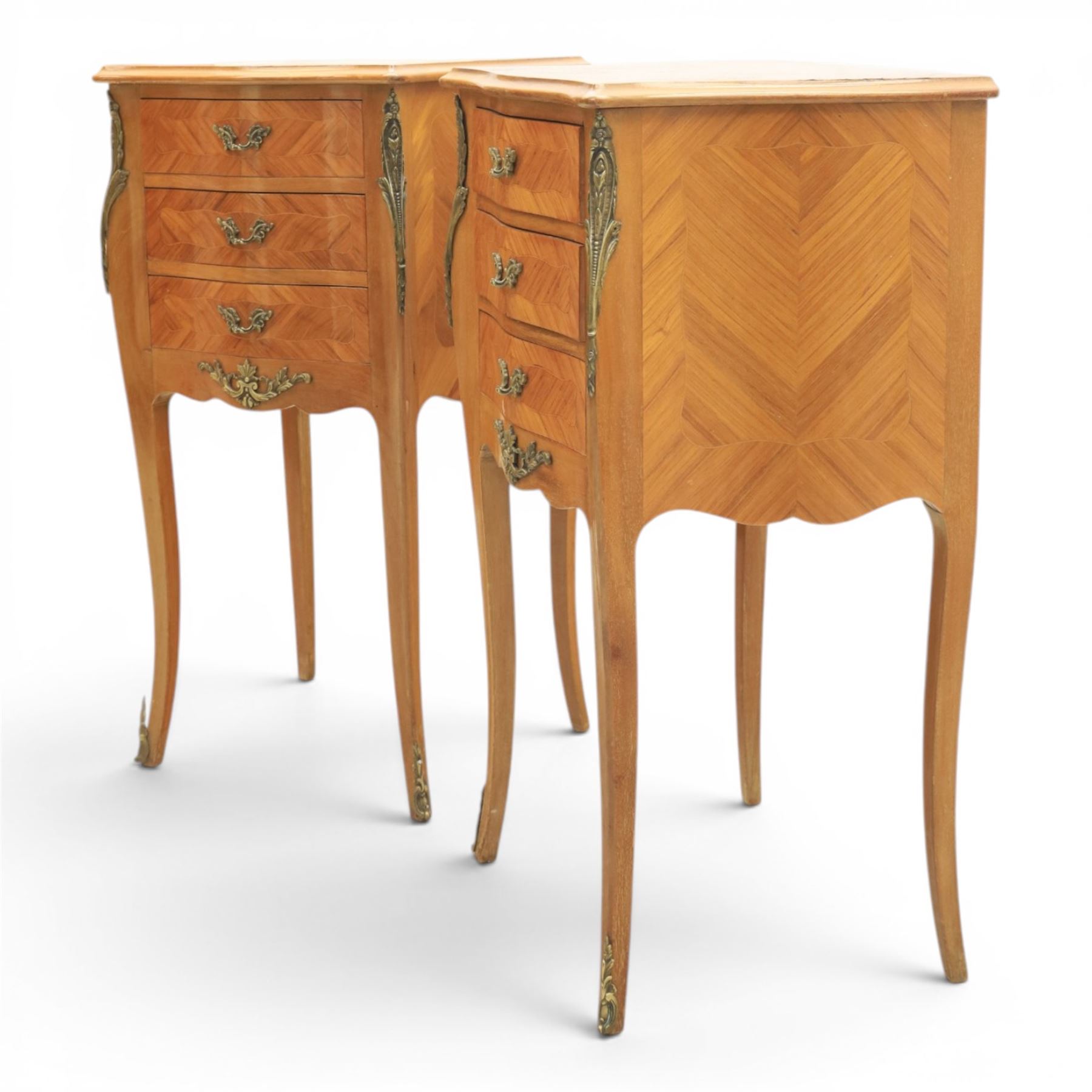 Louis XV style pair of kingwood bedside chests, each of serpentine outline with three parquetry drawers, gilt metal mounts and handles, raised on slender cabriole legs