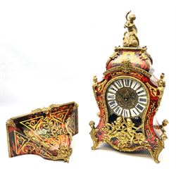 Contemporary Italian Boulle clock with a conforming wall bracket in simulated tortoise shell and brass inlay, case and bracket profusely decorated with applied gilded ornamentation depicting cherubs, figures and rococo scrollwork, brass dial with individual inset porcelain panels with roman numerals, steel serpentine hands and visible sunburst pendulum, with an eight-day twin-train striking movement, striking the hours and half hours on two bells. 
Clock H58 W33 D14
Bracket H20 W36  D18

