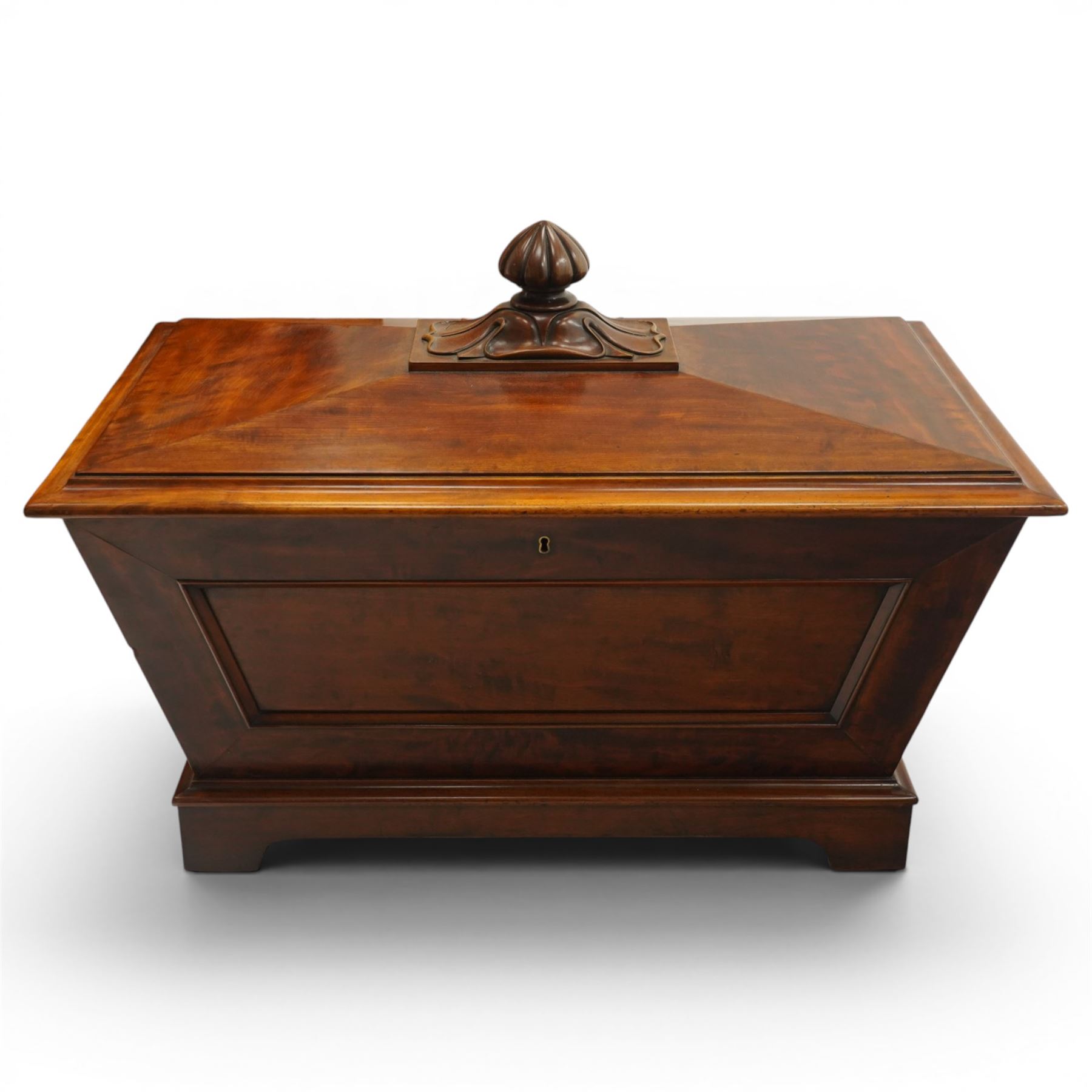 Thomas & George Seddon (1815-1870) - Pair of mid-19th mahogany cellarettes of sarcophagus form, the hinged and panelled top surmounted by a gadrooned and lappet carved knop, surrounded by a moulded edge, enclosing a lead lined wine cooler interior to one, the other paper lined, lower moulded edge over bracket feet and castors