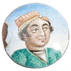Qajar period enamel plaque depicting a portrait of a young man, D2.1cm, together with a 19th century gilt metal and guilloche enamel stick pin
