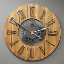  Large circular planked pine wall clock with Roman numerals, skeleton simulated workings with battery movement, Diameter - 80cm  