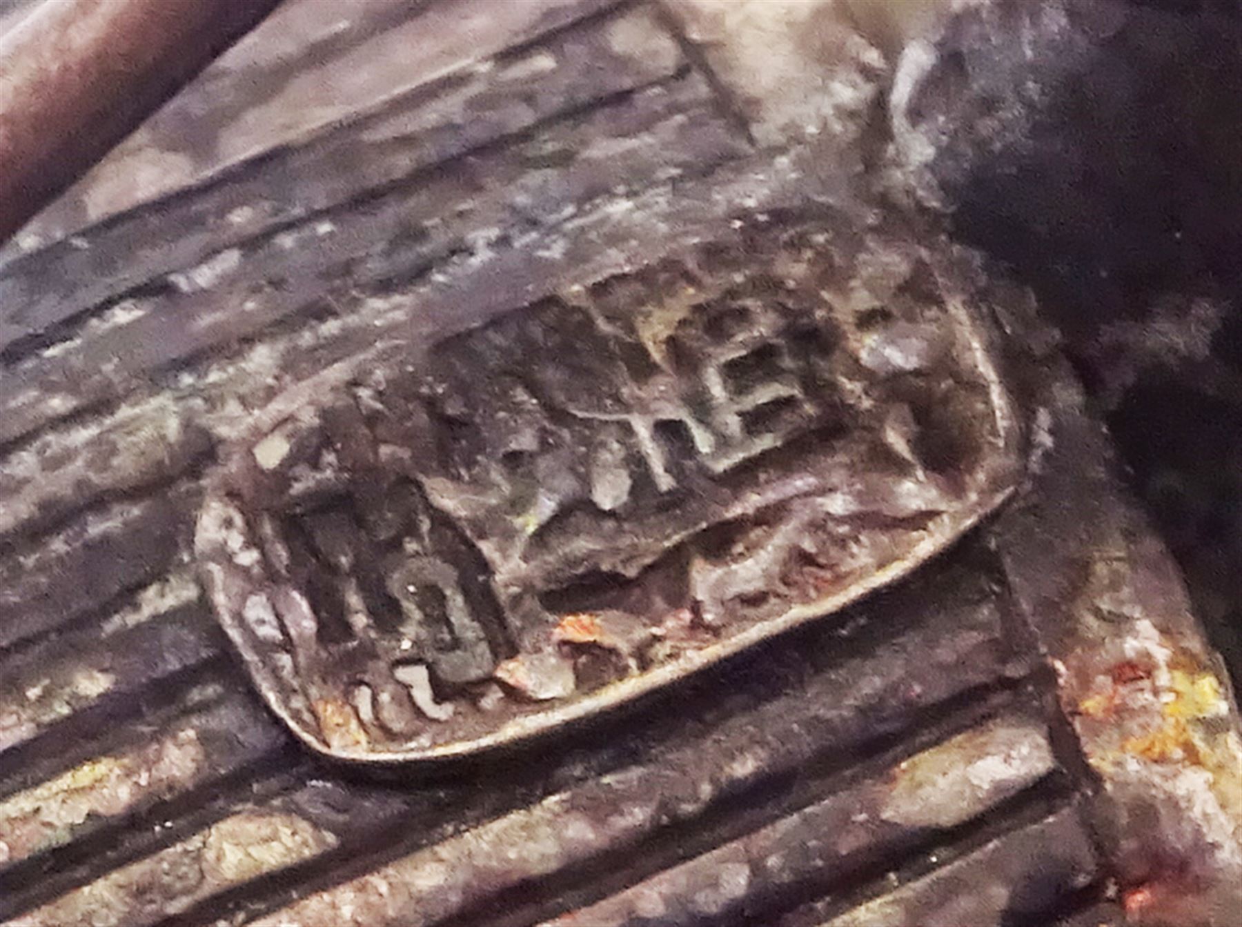 Chinese miniature silver model of a junk, with character mark to stern, mounted upon a carved wooden stand, overall H5cm L6.5cm