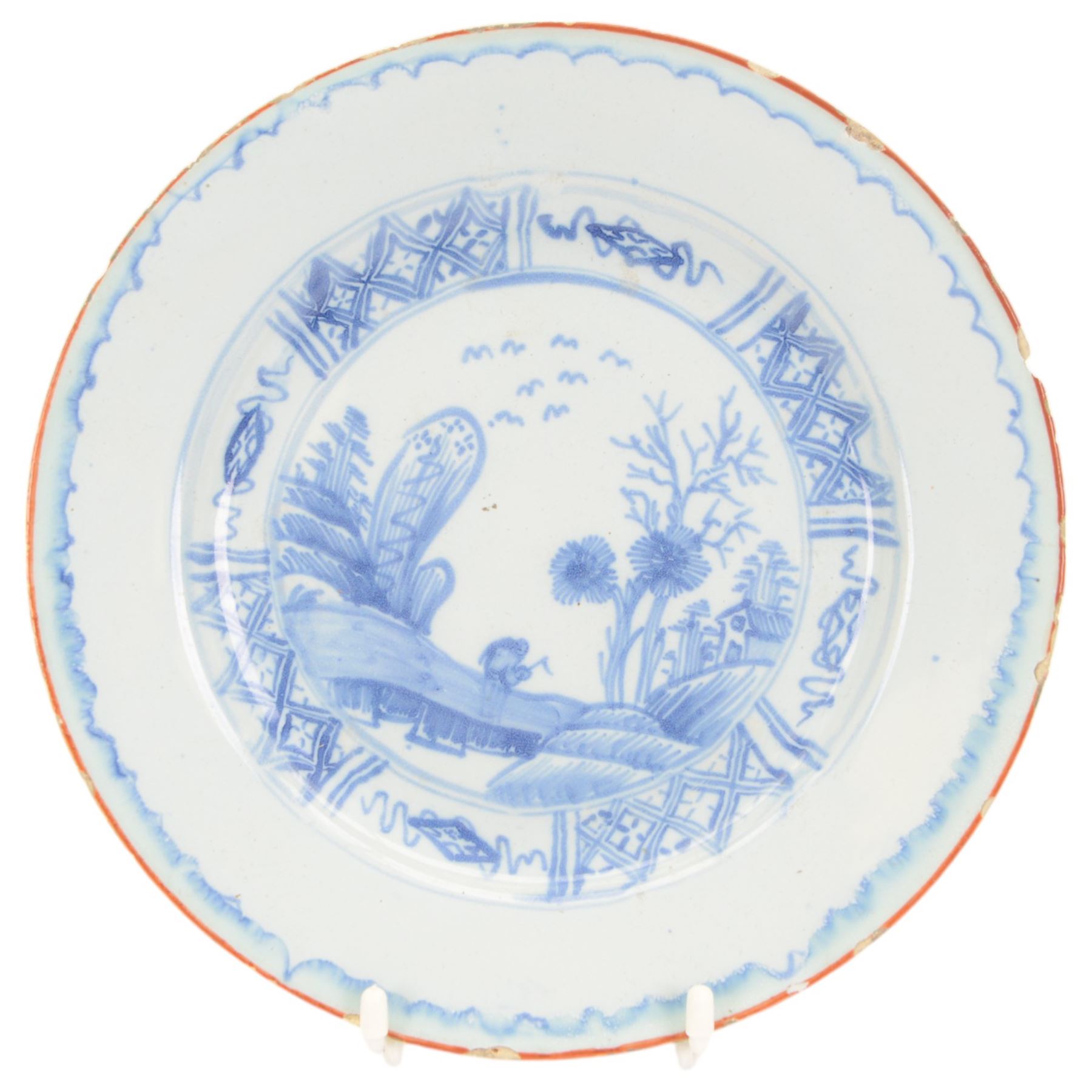 Five 18th century blue and white English and Dutch Delft plates, to include an example probably by the Abigail Griffith Delftworks in Lambeth, London, circa 1765-1775, depicting a landscape scene with house and tree, contained within geometric borders, D23cm, largest example D30cm 