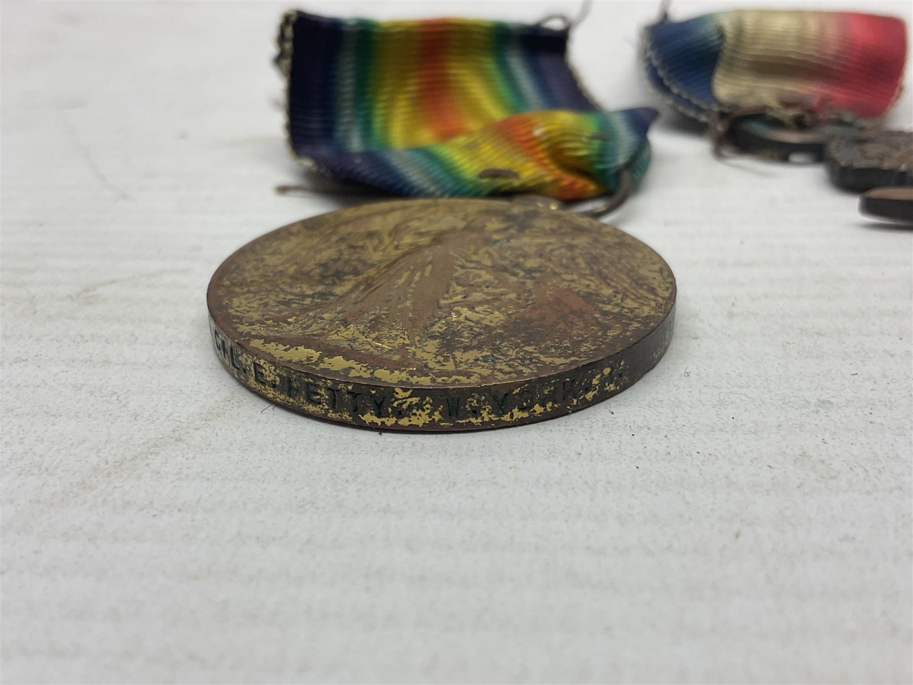 WWI pair of medals comprising British War Medal and Victory Medal awarded to 32682 Pte. W. Meadows W. Rid. R. in issue box; WWI pair of medals comprising 1914-15 Star and Victory Medal awarded to 3720 Pte. (later Cpl.) E. Petty W. York. R. with issue letter from Tank Corps; WWII group of five medals comprising 1939-45 War Medal, Defence Medal and 1939-45, Italy and Africa Stars; all with ribbons; and book of nineteen seaman's Certificates of Discharge to cook Charles Filburn 1893 - 1901 from various British ports