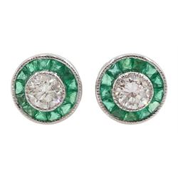 Pair of 18ct white gold round diamond and calibre cut emerald circular stud earrings, stamped 750