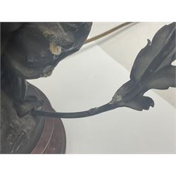 Pair of Art Nouveau style spelter figural table lamps, each mounted on rouge marble effect circular bases, with toleware flower heads and leafy decoration surrounding a female figure, H90cm