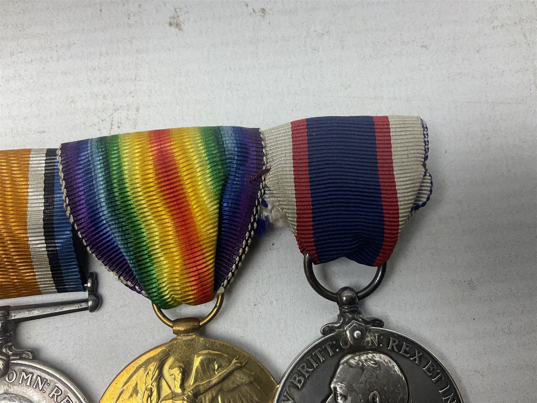 WW1 British Royal Navy Campaign and Royal Naval Fleet Reserve Long Service and Good Conduct group of five medals comprising British War Medal, 1914-15 Star and Victory Medal awarded to SS.113274 J.W. Baines Sto.1 R.N.; Naval general Service Medal to J.W. Baines Sto.1 N.B.; and Royal Fleet Reserve Long Service and Good Conduct Medal to SS.113274 (Dev. B.7397) J.W. Baines Sto.1 R.F.R.; all with ribbons