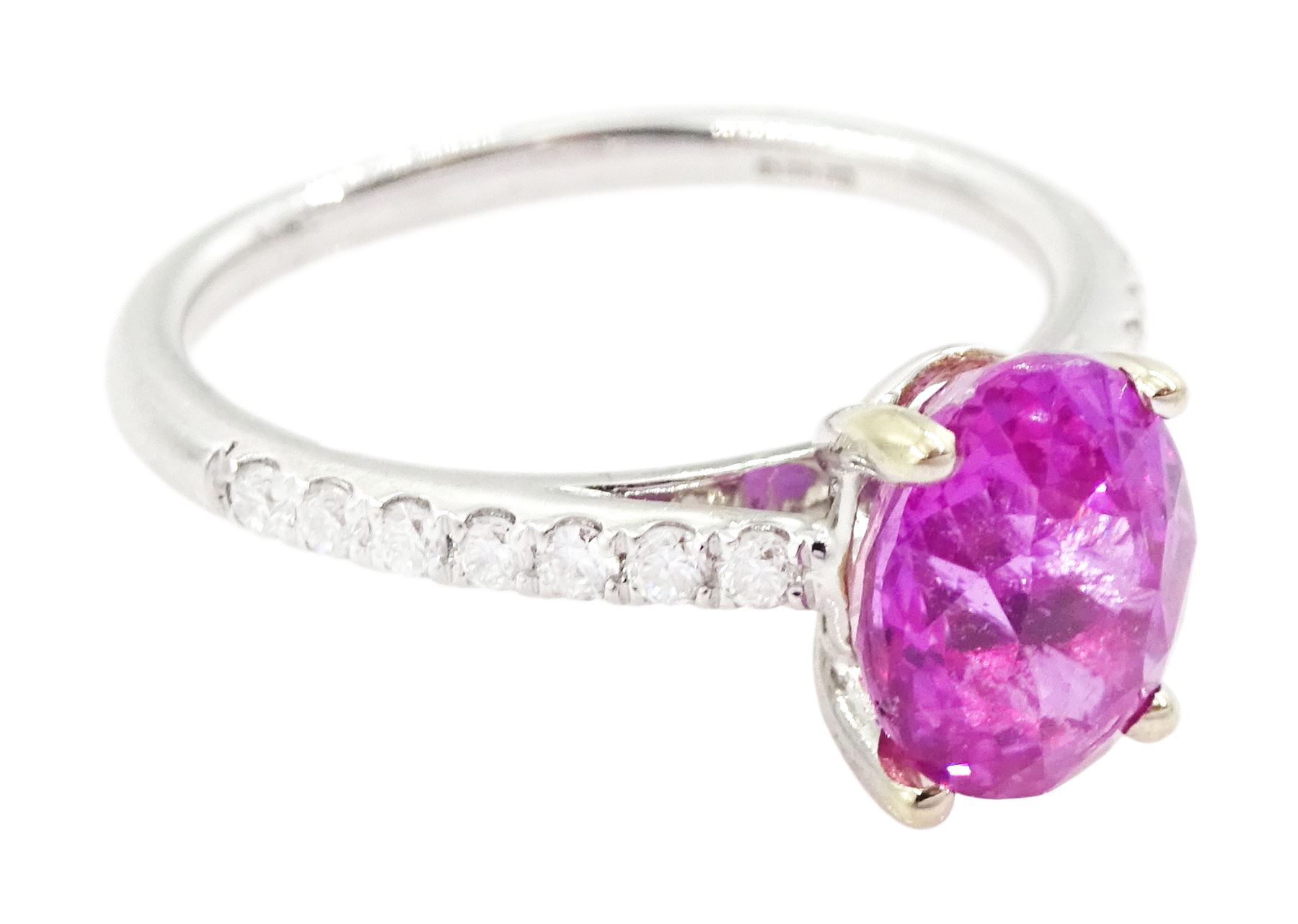 18ct white gold pink sapphire and diamond ring, single oval cut sapphire of approx 2.80 carat, with round brilliant cut diamond shoulders, hallmarked