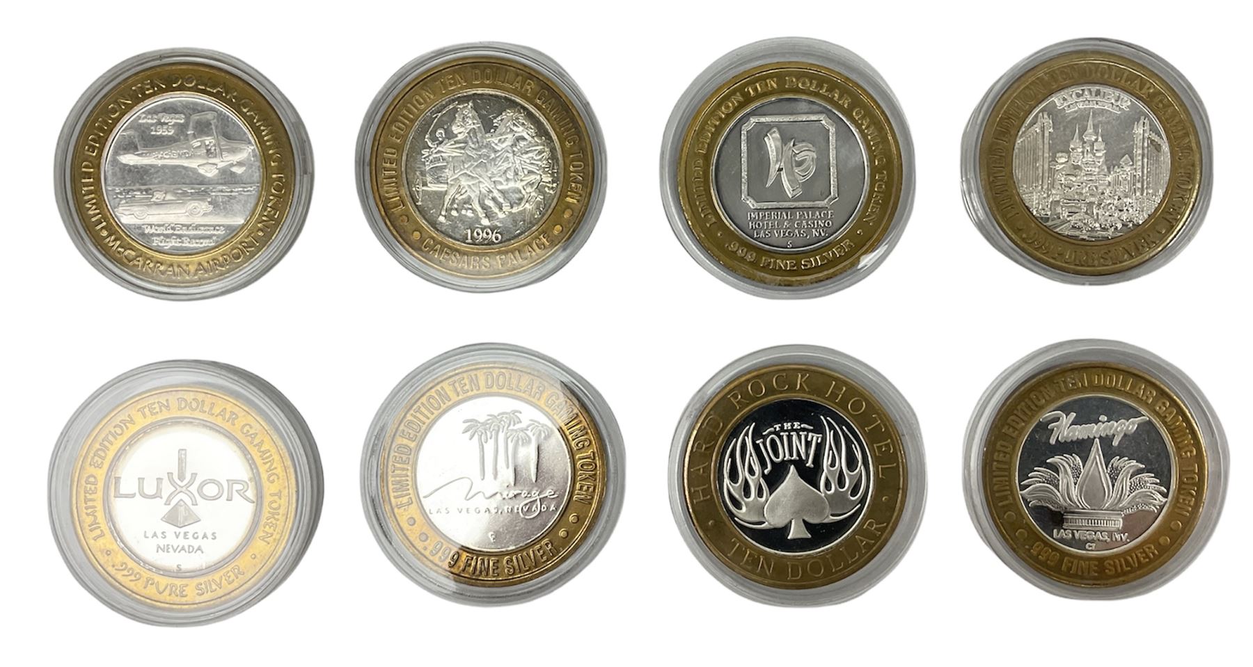 Eight Las Vegas limited edition ten dollar casino silver strike gaming tokens, consisting of a fine silver centre with brass outer ring (8)