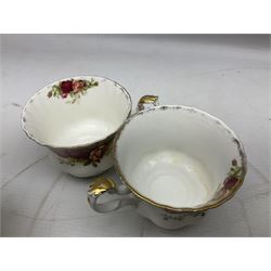 Royal Albert Old Country Roses pattern tea service for six, comprising six teacups and saucers, teapot, coffee pot, two jugs, two sucriers, six side plates, cake plate and twin handles square dish