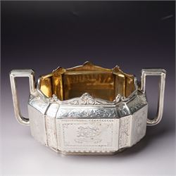 Victorian silver tea and coffee set engraved with classical urns, oval paterae and scrolling foliage, monogram and 'Diligentia et Honore' comprising teapot, tea kettle on spirit heater stand, coffee pot, two handled sugar bowl and cream jug Sheffield 1891 Maker John Round & Son Ltd