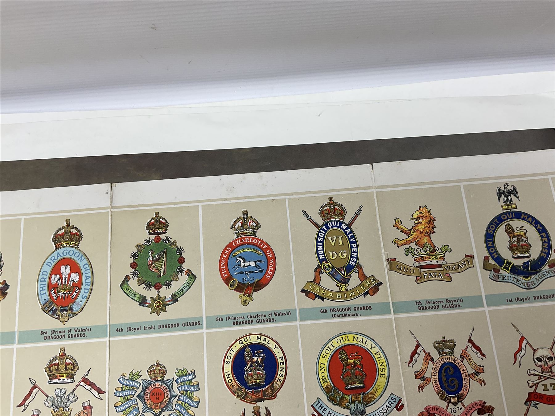 Large poster entitled 'Crests and Badges of the British Army in Daily Use 56 x 86cm; together with twenty-five colour prints of military interest including Crimean War, Boer War, WW2 etc; various sizes; all unframed