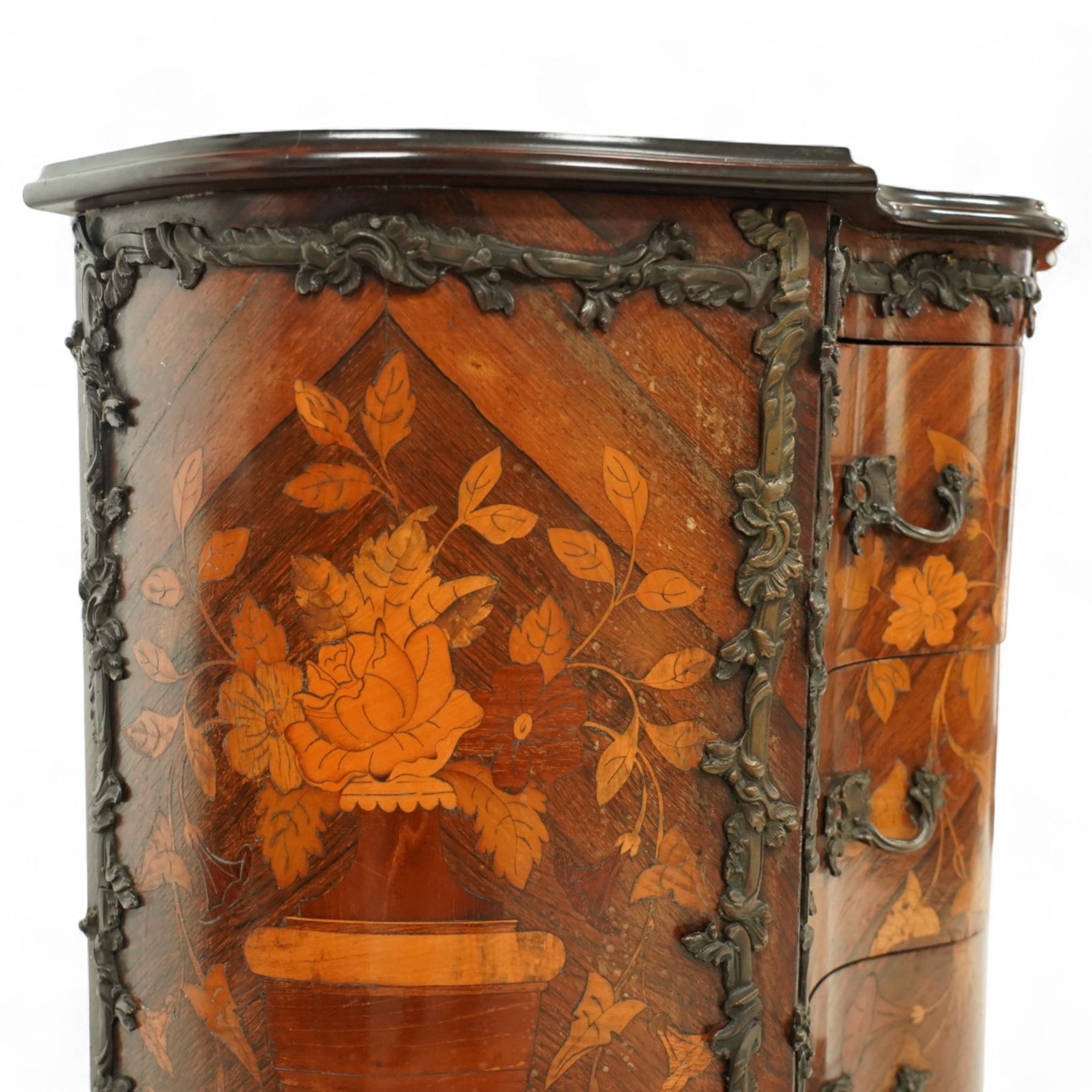 French Louis XV design serpentine fronted rosewood and fruitwood commode, the later shaped mahogany top over  three drawers, inlaid with a floral marquetry urn and flowers, within ormolu mounted borders, the sides inlaid with matching bouquet marquetry, raised on bracket feet