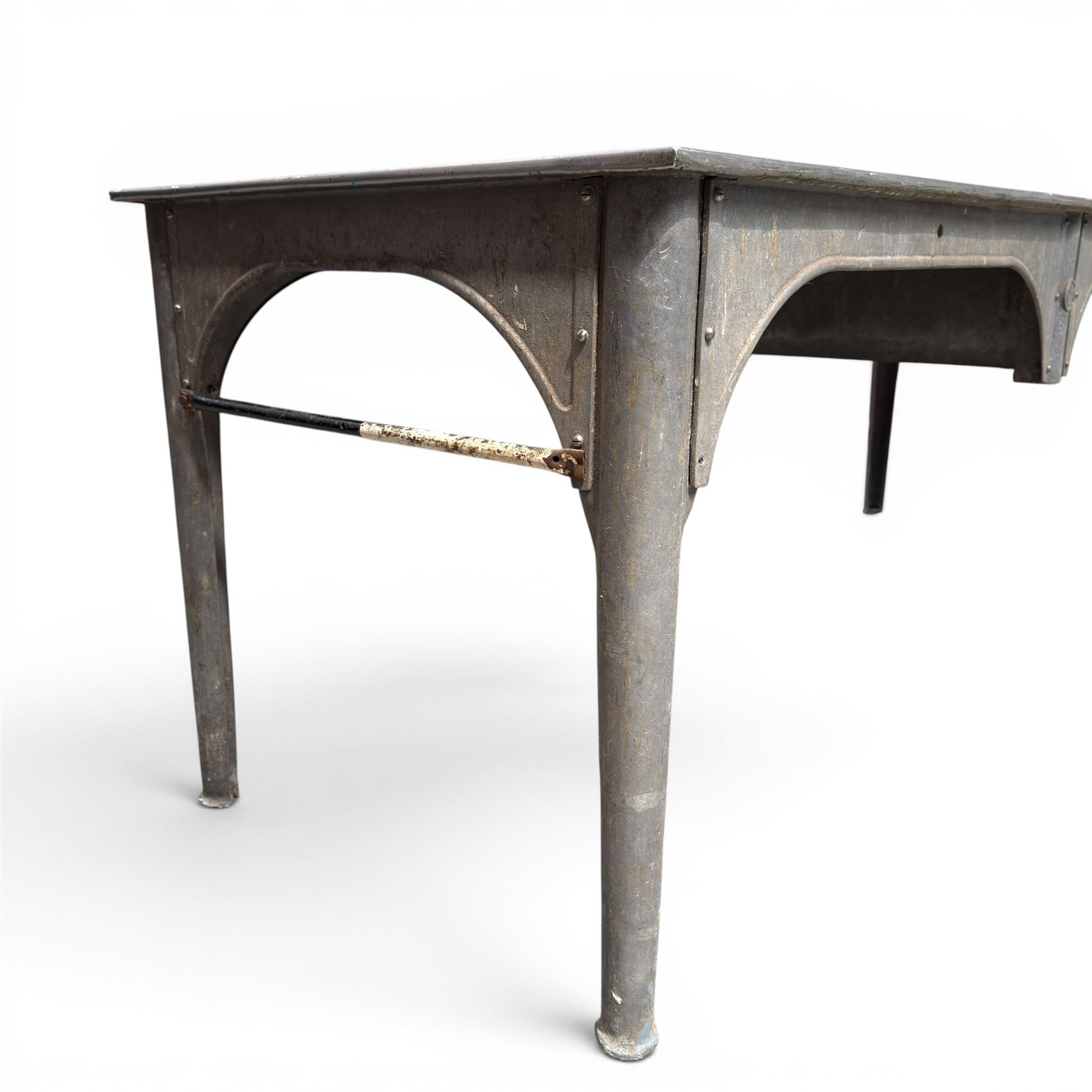 Large galvanised steel industrial or work table, rectangular top over tapering supports, stamped APVO