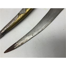 Late 19th/20th century Middle Eastern jambiya dagger the 36cm broad curved double edged steel blade with traces of script, horn and copper backed waisted white metal hilt with three roundel buttons; in ornate white metal and leather mounted brass and steel scabbard L60.5cm overall