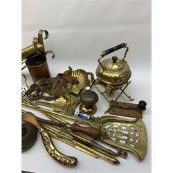 A group of assorted metalware, to include brass fire accessories, brass crumb tray and brush, set of three copper measures with brass handles, brass spirit kettle with burner stand, brass rolling pin, pair of knopped brass candlesticks, etc.  