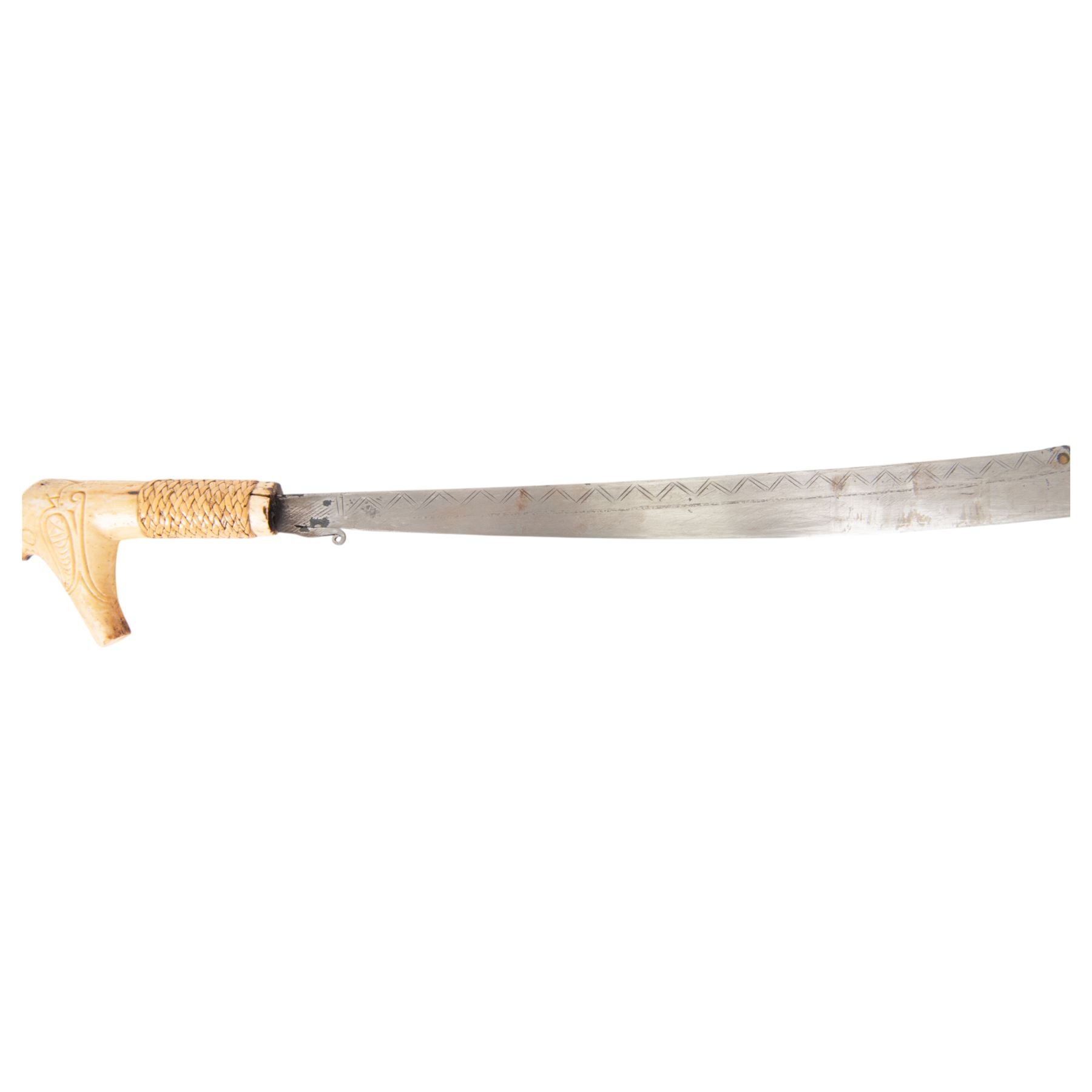 Borneo Dayak Mandau knife, with carved bone handle and wooden scabbard, overall L64cm