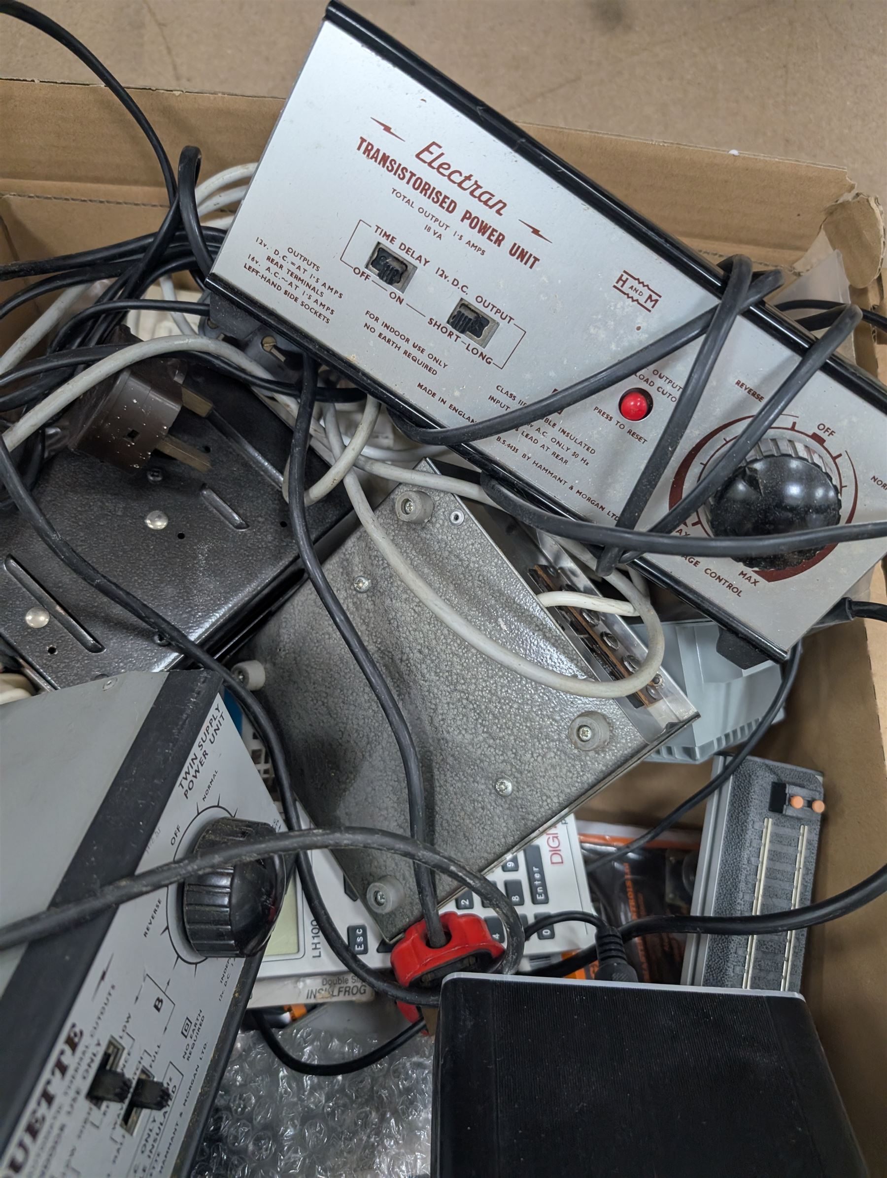 Collection of model railway control units, accessories and tools, including Lenz Digital Plus LZV100 with remote, H and M Electran Transistorised Power Unit, H and M Duette twin supply unit, motors, points, paints, Antex Soldering System, Flockit, etc, in three boxes