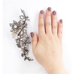 19th century gold and silver diamond and pearl en tremblant detachable brooch, the flower tremblant with a principal old cut diamond of approx 1.90 carat, the petals and stamen set with old cut and rose cut diamonds, total diamond weight approx 9.10 carat, to a foliate spray set set with further rose cut diamond and white / pink / cream pearls and ribbon tie