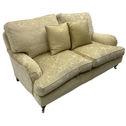 Multi-York - Howard shape two-seat sofa, upholstered in scrolling floral pattern loose covers, rolled arms, on turned front feet with brass cups and castors