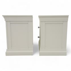 Coxwold Company - pair of white painted jumbo bedside cabinets, with two deep drawers and chrome knob handles,  shaped apron base