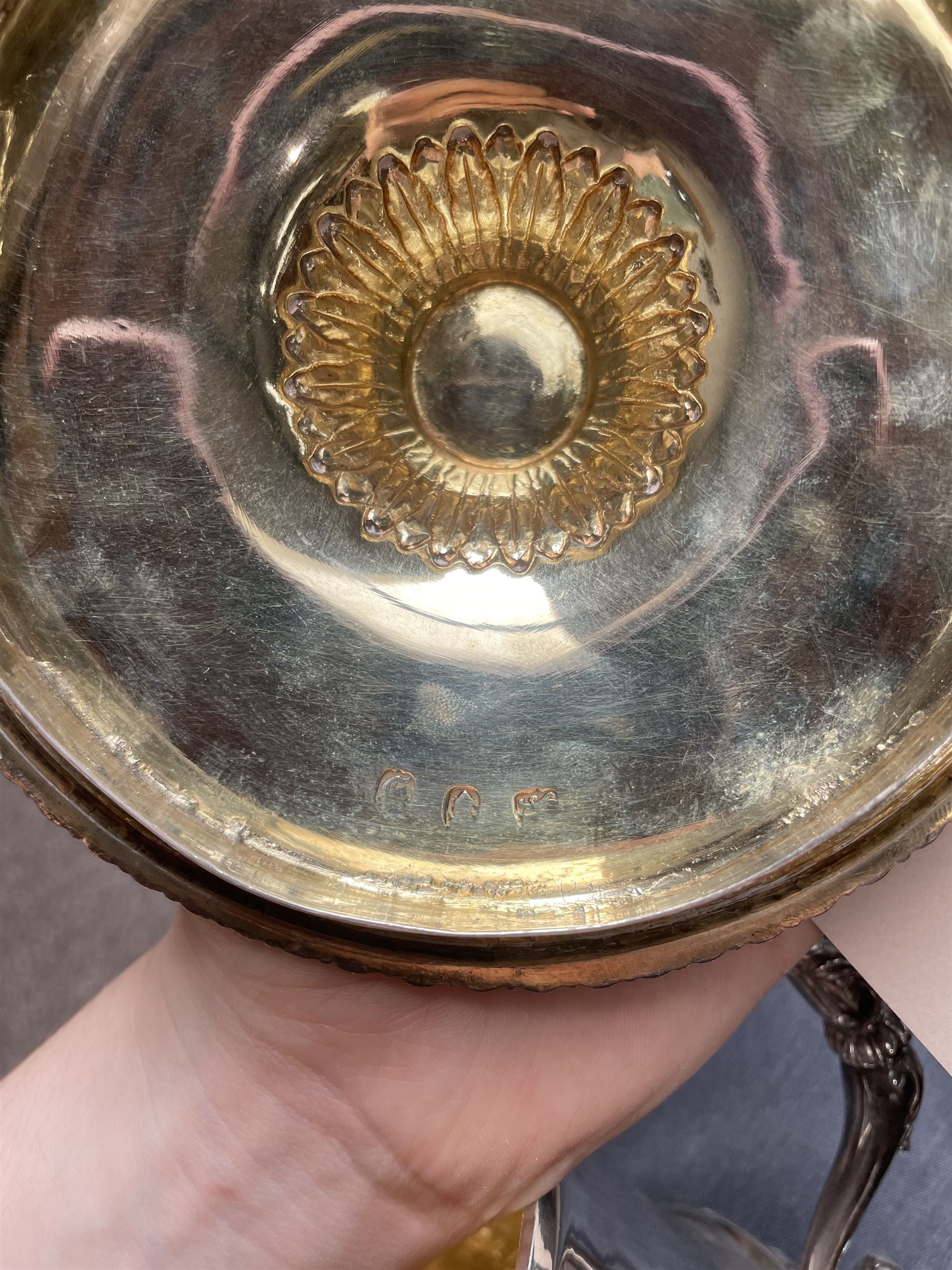 George III silver two handled campana shape cup and cover with pineapple lift, the body with cartouche surrounded by flowers above leaves and scrolls on a pedestal foot with acanthus leaf decoration H29cm London 1764, makers marks rubbed