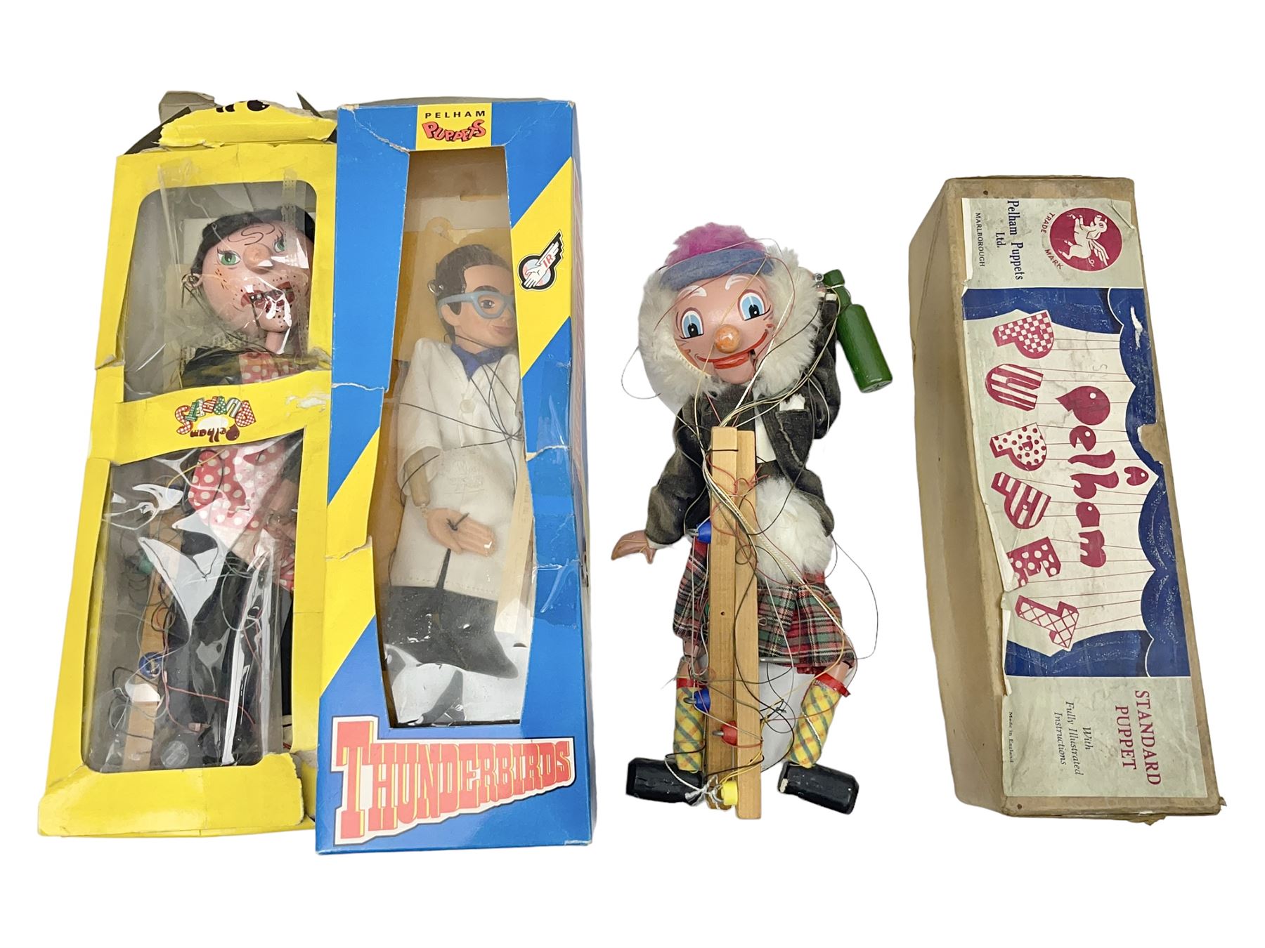 Three Pelham puppets - 'Brains' from Thunderbirds in blue/yellow box; Witch in yellow window box; and Macboozle in brown box (3)
