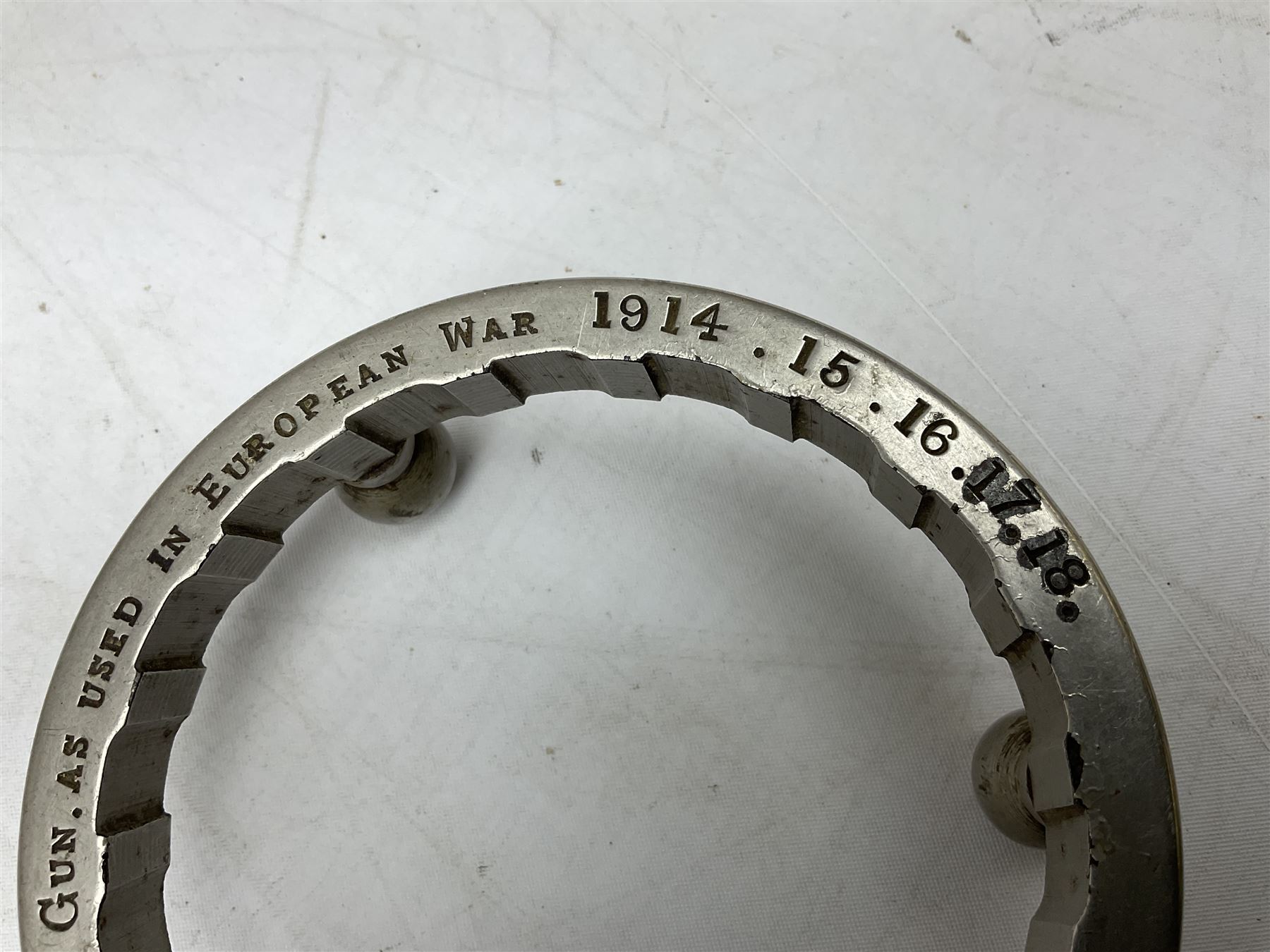 WW1 Trench Art - trivet on three ball feet formed from a section of a gun barrel inscribed 'Part of 18Pr Field Gun, as used in European War 1914.15.16.17.18.' D10cm