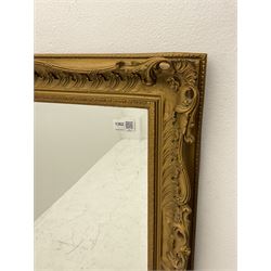 Victorian style rectangular wall mirror in gilt swept frame, bevelled plate
