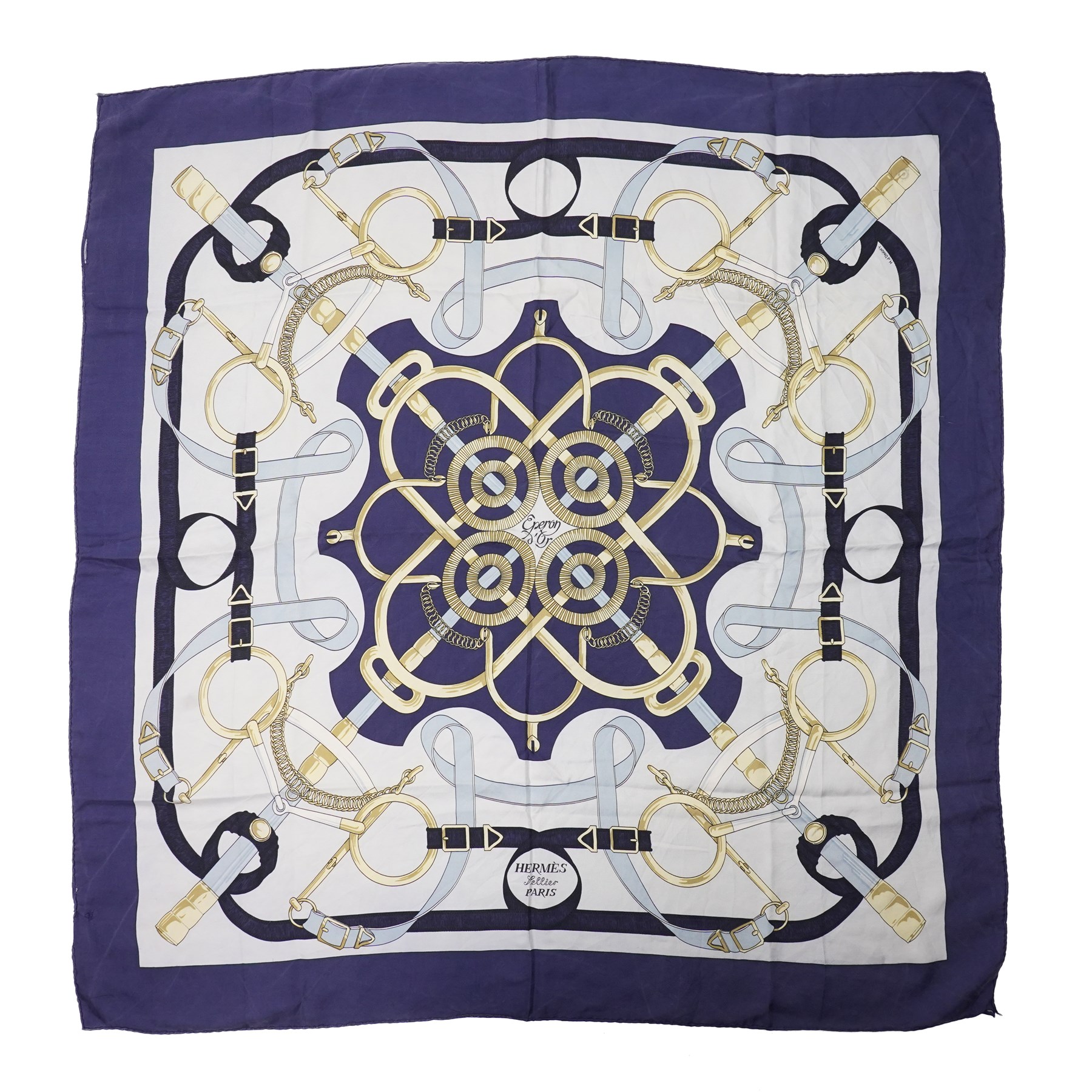 Hermès - ‘Éperon d’Or’ silk scarf, designed by Henri d’Origny, first issued 1974, navy, pale blue, ivory and gold colourway with hand-rolled edges