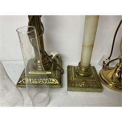 Oil lamp with frosted floral shade and cut glass reservoir, upon cast brass and marble base, together with a cast brass Corinthian column table lamp, pair of brass table lamps and a composite metal figure of a violinist 