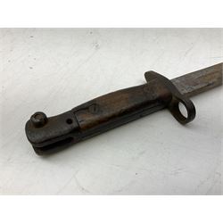 British Pattern 1907 bayonet with 43.5cm fullered steel blade; in leather scabbard with webbing frog L58cm overall; another Pattern 1907 bayonet lacking scabbard; and British Pattern 1888 Mk.I bayonet by Wilkinson London (no scabbard) (3)