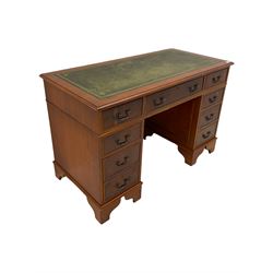 Yew wood twin pedestal office desk, fitted with nine drawers