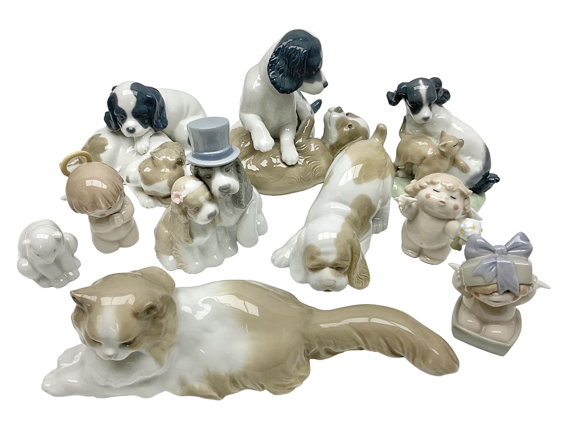 Ten Nao figures, to include three Cheeky Cherubs, Cat, Dog bride and groom etc