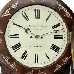 Joseph Critchley of Liverpool -  early 19th century twin fusee 8-day rosewood and mother of pearl inlaid drop-dial wall clock c1820, inlaid circular wooden dial surround with carved ears representing grapes and vine leaves, glazed box with a scroll carved surround, curved base and pendulum adjustment door, 14” painted dial with Roman numerals, minute track, and pierced steel hands within a cast brass bezel and flat glass, dial pinned to a four pillar chain driven fusee movement striking the hours on a bell. With pendulum and key.