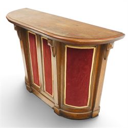 Arts & Crafts oak D-shaped bar, moulded edged counter above a front with velvet applied panels, the back with shelving, raised on a plinth base