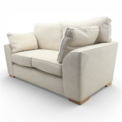 Next Home - Contemporary two seat sofa, square back and arms, upholstered throughout in beige fabric, fitted with two loose seat cushions and two loose back cushions, with arm cushions, raised on block wooden feet