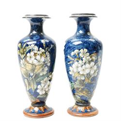 Pair of Doulton Lambeth vases, painted with white flowers, impressed marks to base and signed MA, for Mary Aitken, 1878, H28cm (2)