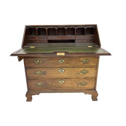 Early George III mahogany bureau, the fall-front concealing fitted interior with inset green leather writing surface, above four long graduating drawers with cock-beaded facias, each with pierced pressed brass escutcheons and handle plates, lower moulded edge over ogee feet